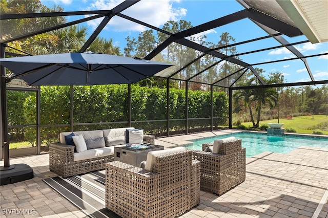 view of pool featuring an outdoor living space, a patio, and a lanai