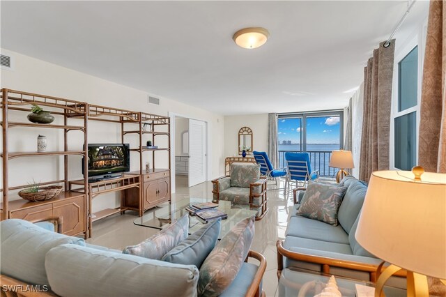 living room featuring floor to ceiling windows