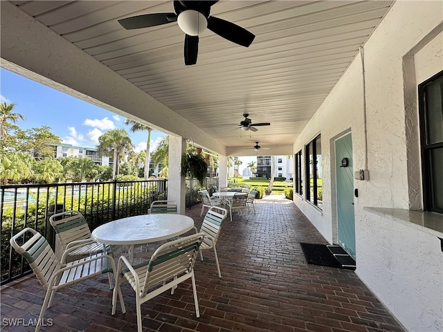 view of patio featuring ceiling fan