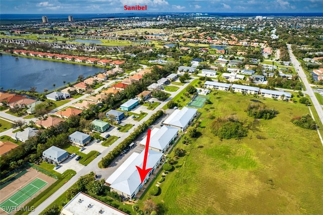 bird's eye view featuring a water view and a residential view