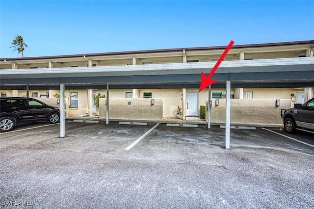 view of car parking featuring a carport