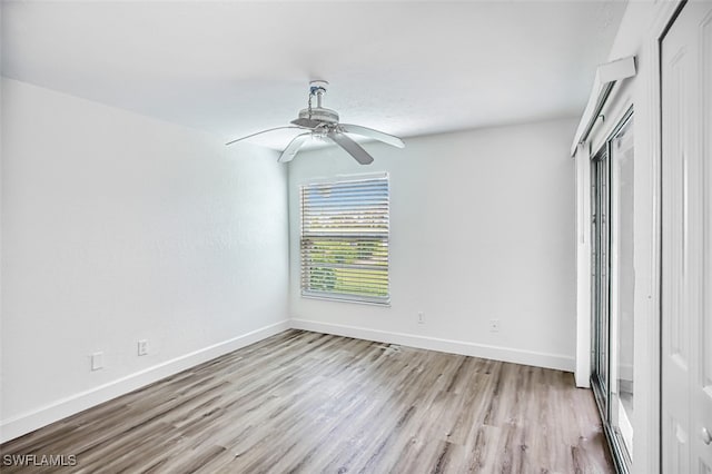 unfurnished bedroom with light wood-style floors, baseboards, and ceiling fan