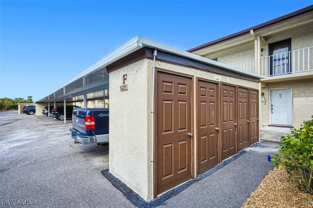 view of outbuilding with a carport