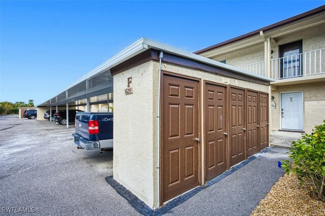 16251 Dublin Cir Unit F104, Fort Myers, FL 33908 - exterior space featuring covered parking