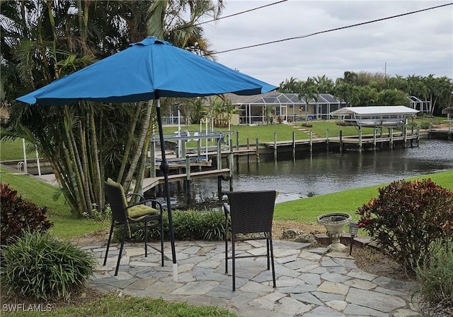 dock area with a yard and a water view