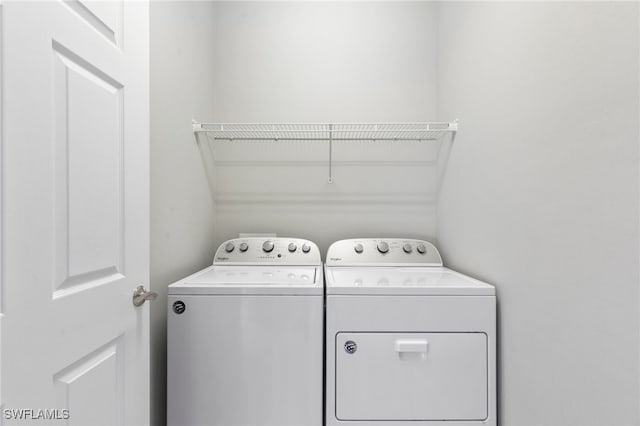 laundry room with independent washer and dryer