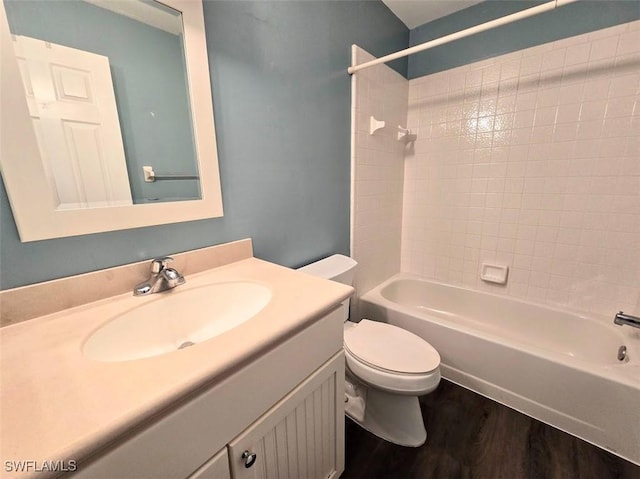 full bathroom with vanity, hardwood / wood-style flooring, bathtub / shower combination, and toilet