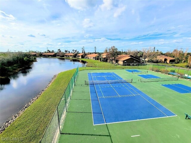 view of sport court with a water view