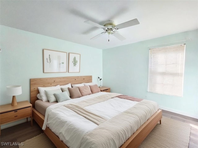 bedroom featuring hardwood / wood-style floors and ceiling fan