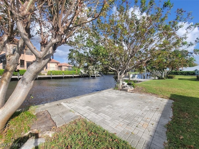 exterior space with a water view and a front yard