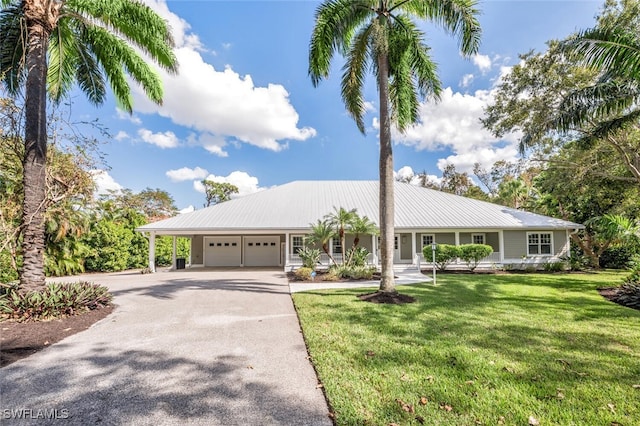 ranch-style home with a front yard and a garage