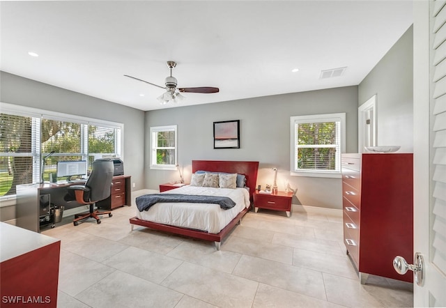 bedroom featuring light tile patterned floors and ceiling fan