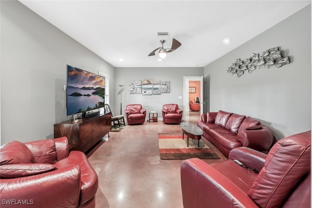 living room featuring concrete flooring and ceiling fan