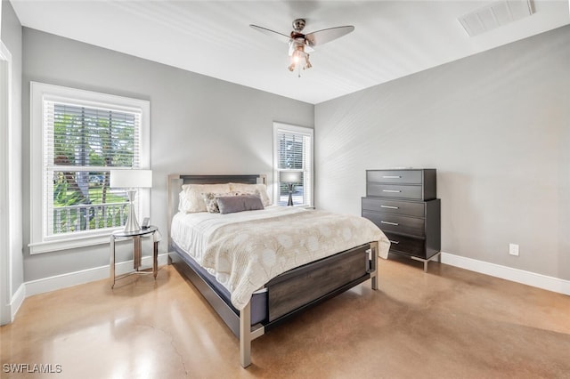 bedroom with concrete floors and ceiling fan