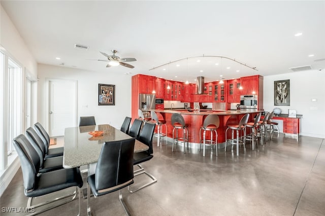 dining space with ceiling fan