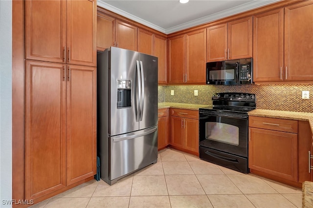 kitchen with crown molding, decorative backsplash, light stone countertops, and black appliances