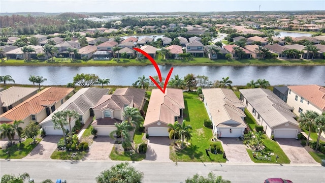 birds eye view of property featuring a water view