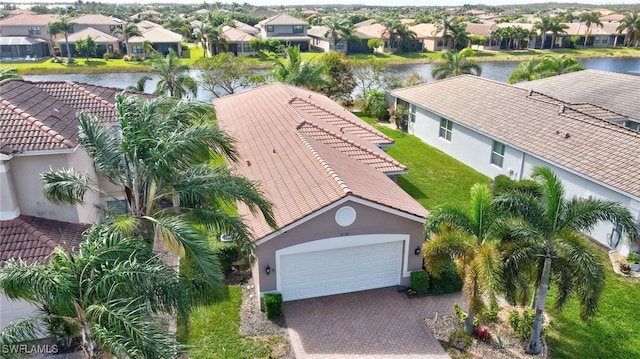 birds eye view of property with a water view