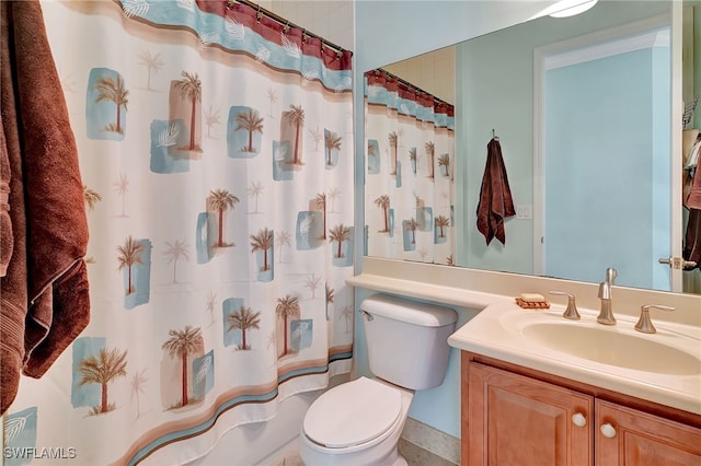 bathroom featuring toilet, vanity, and a shower with shower curtain