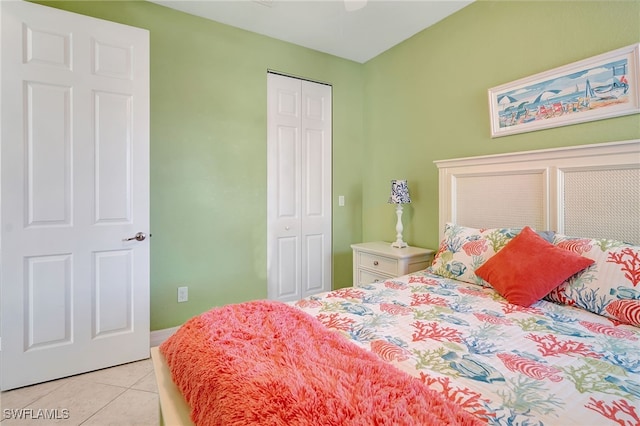 bedroom featuring a closet and light tile patterned floors