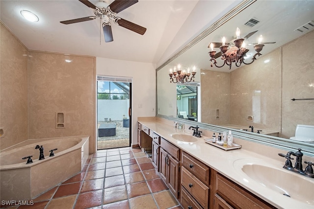 bathroom with ceiling fan with notable chandelier, vanity, a bath, and vaulted ceiling