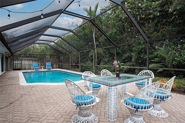 view of pool featuring a patio area and a lanai