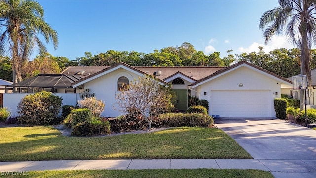 ranch-style home featuring a garage and a front yard