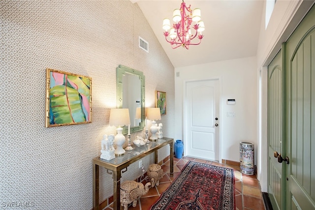 interior space featuring high vaulted ceiling and a chandelier