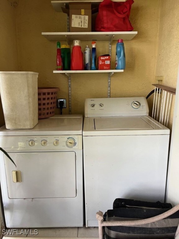 washroom featuring independent washer and dryer