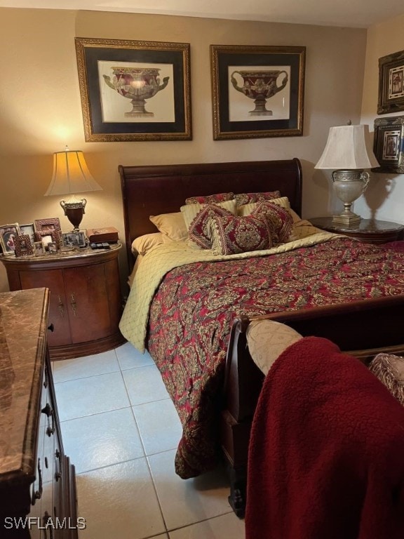 bedroom with light tile patterned floors