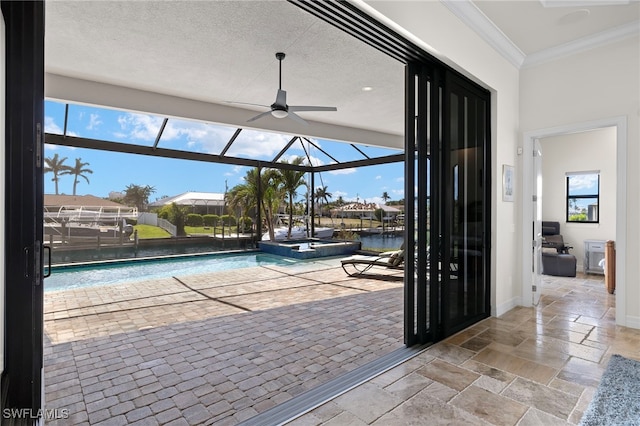 view of swimming pool with a water view and ceiling fan