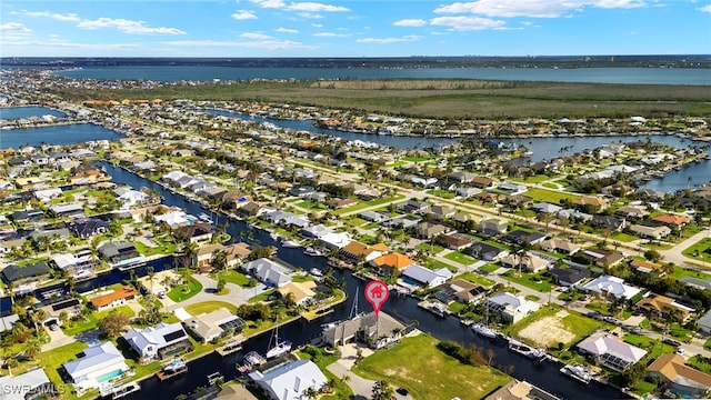 birds eye view of property featuring a water view