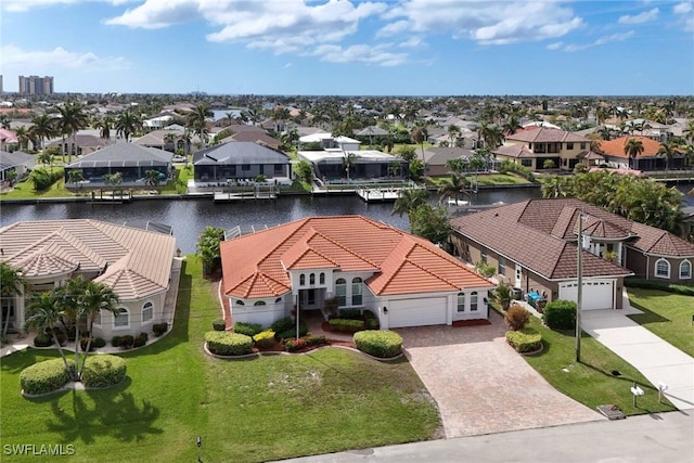 birds eye view of property featuring a water view