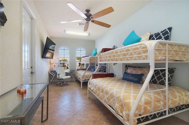 tiled bedroom with ceiling fan