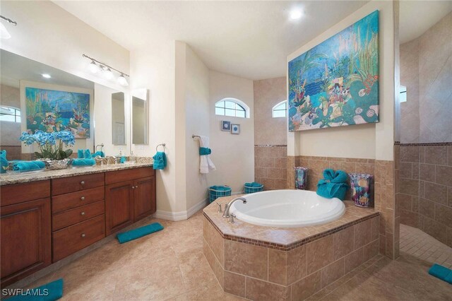 bathroom featuring vanity, tile patterned floors, and independent shower and bath