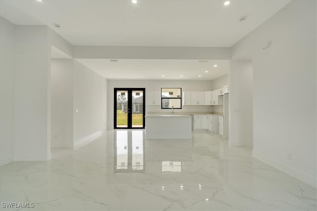 empty room with french doors and sink