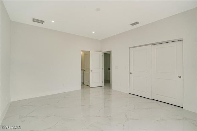 unfurnished bedroom with a closet