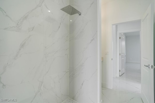 bathroom with a tile shower