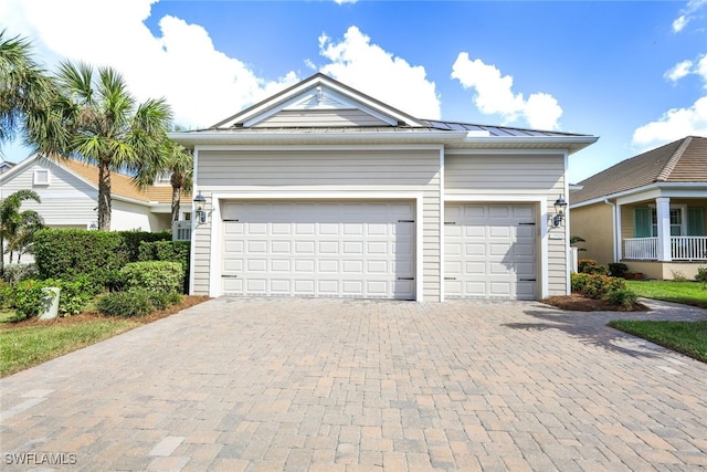 view of front of property with a garage