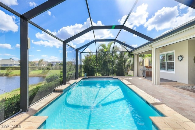 view of swimming pool featuring a lanai, a patio area, a water view, and grilling area