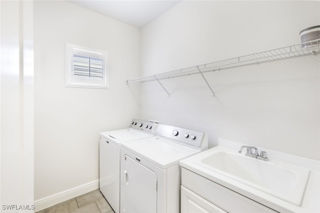 laundry area with sink and independent washer and dryer