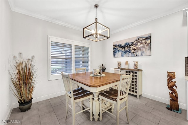 dining area with ornamental molding and an inviting chandelier