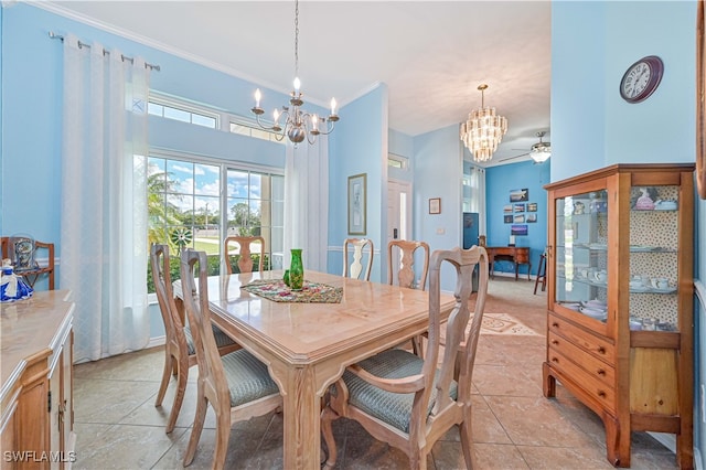 tiled dining space featuring crown molding and ceiling fan with notable chandelier