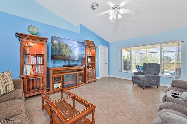 tiled living room with ceiling fan and lofted ceiling