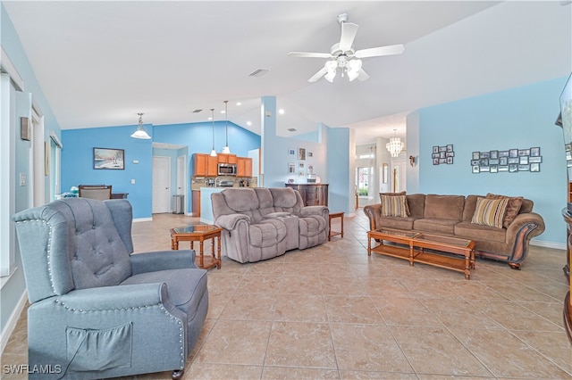 living room featuring lofted ceiling, ceiling fan with notable chandelier, and light tile patterned floors