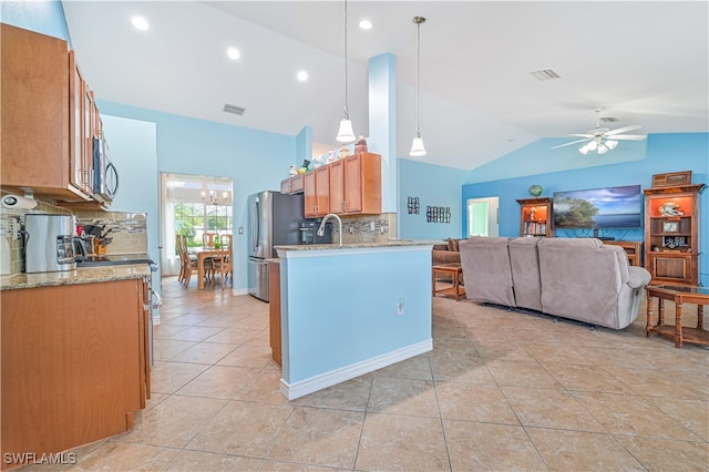 kitchen featuring stainless steel appliances, tasteful backsplash, decorative light fixtures, and ceiling fan with notable chandelier