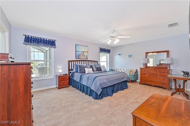 3922 NE 23rd Pl, Cape Coral, FL 33909 - bedroom with light tile patterned floors, baseboards, a ceiling fan, and visible vents