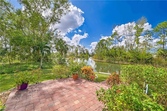 3922 NE 23rd Pl, Cape Coral, FL 33909 - view of patio with a water view