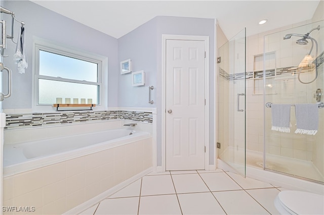 bathroom featuring tile patterned floors, shower with separate bathtub, and toilet