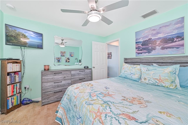 tiled bedroom with ceiling fan